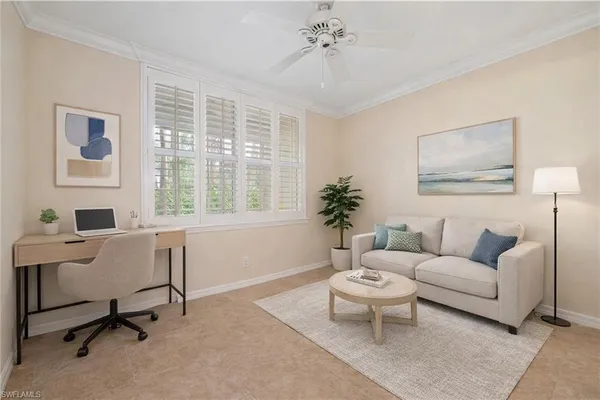 a living room with furniture a table and a large window