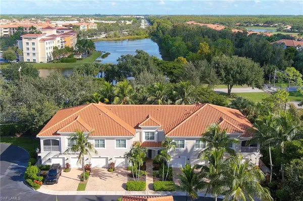 an aerial view of a house with garden space and outdoor seating