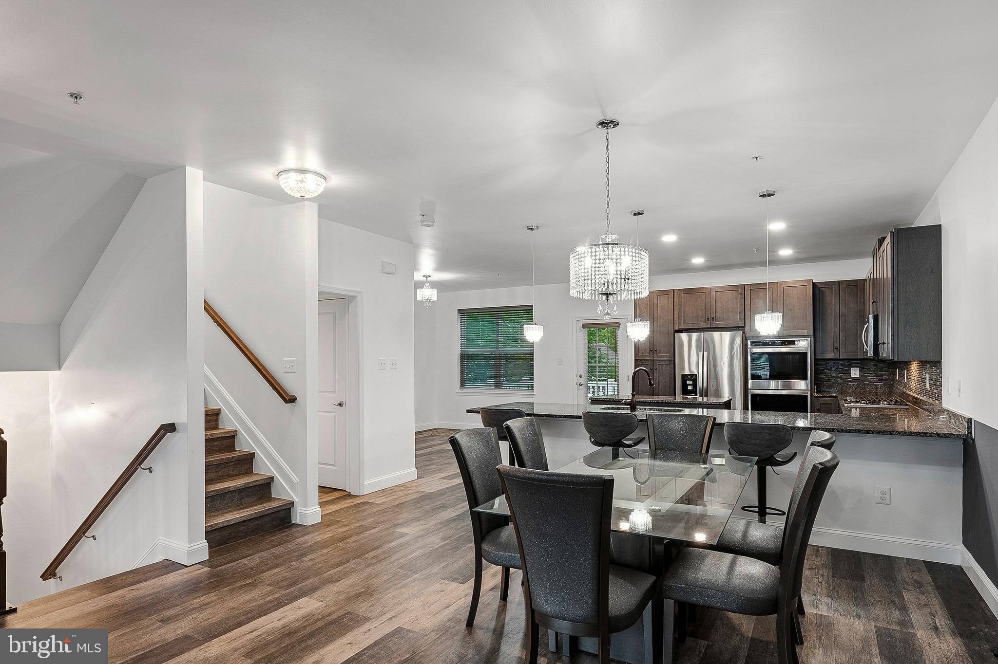 33 Greensborough Road Reisterstown, MD 21136 - Photo 20 of 40 a dining room with furniture a chandelier and wooden floor