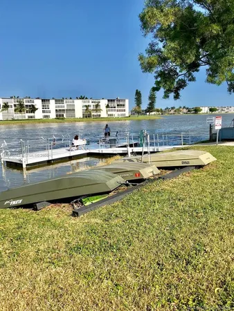 a view of a chair and tables in the patio and a yard
