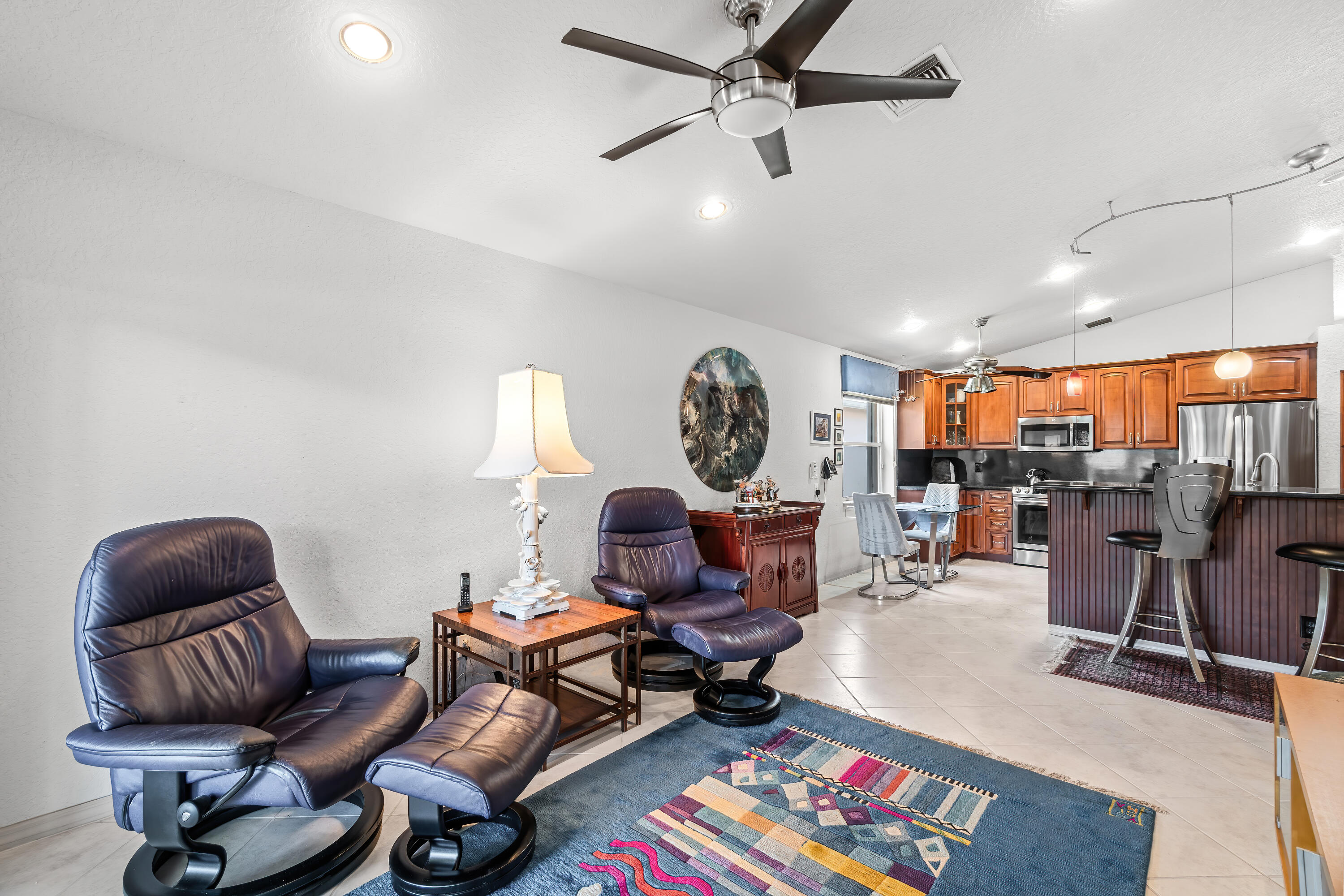 7370 Modena Drive Boynton Beach, FL 33437 - Photo 18 of 37 a living room with furniture a rug and a window