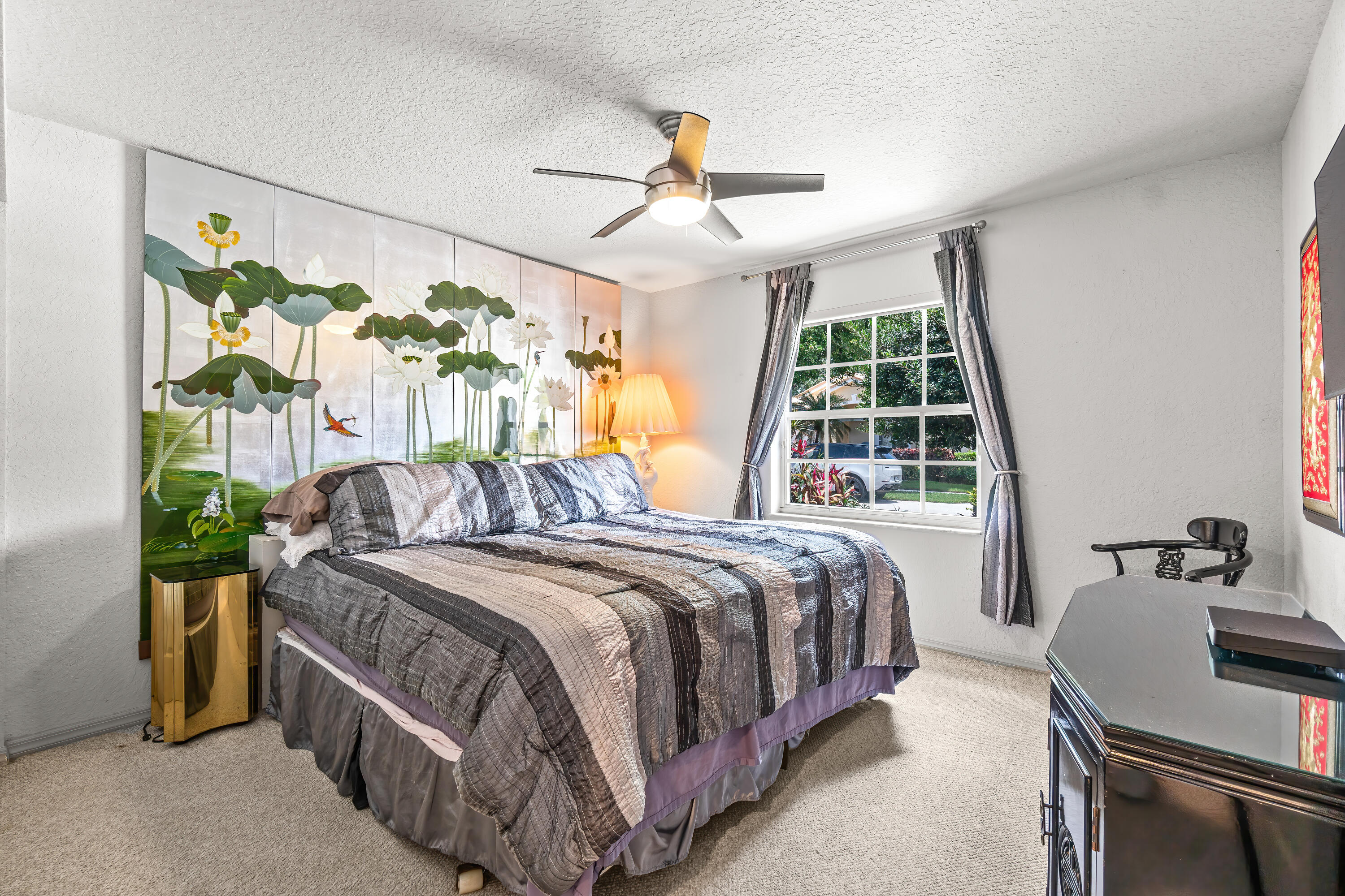 7370 Modena Drive Boynton Beach, FL 33437 - Photo 26 of 37 a bedroom with a bed table flowerpot and window