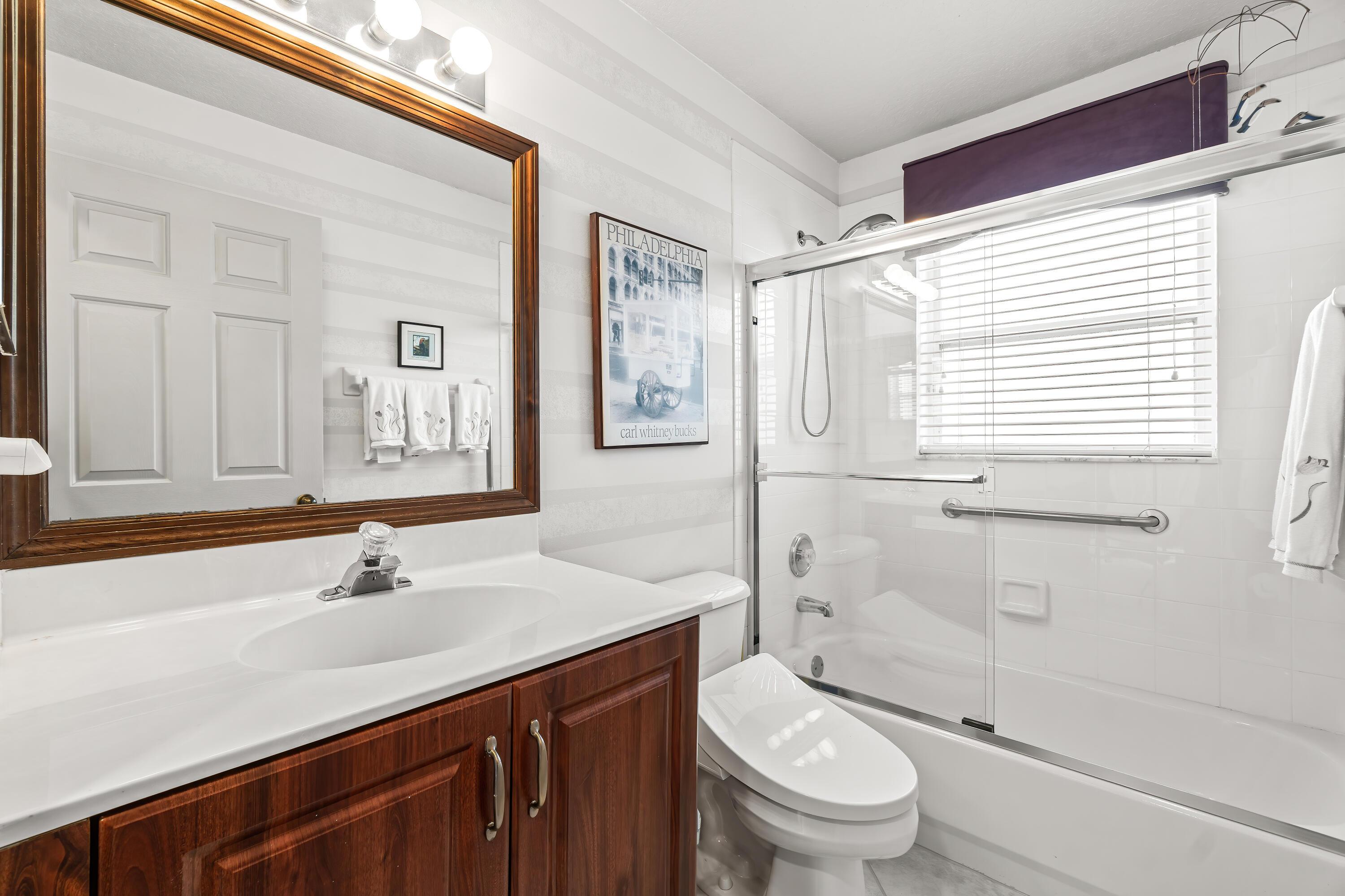 7370 Modena Drive Boynton Beach, FL 33437 - Photo 27 of 37 a bathroom with a sink a toilet and shower