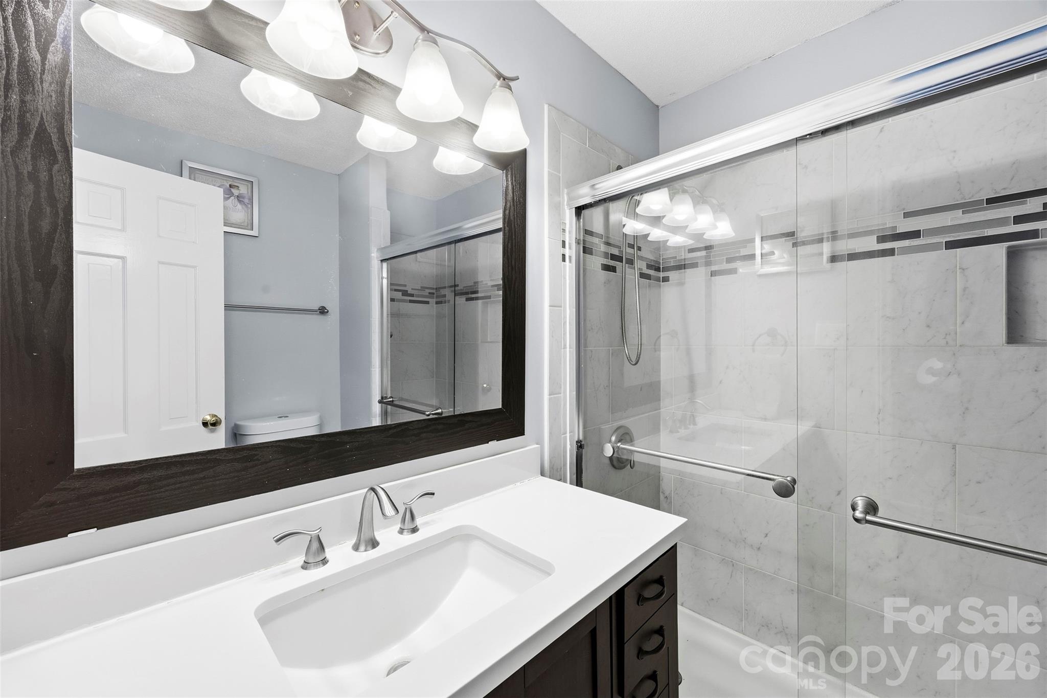 10919 Harrisburg Road Fort Mill, SC 29707 - Photo 26 of 43 a bathroom with a sink and a mirror