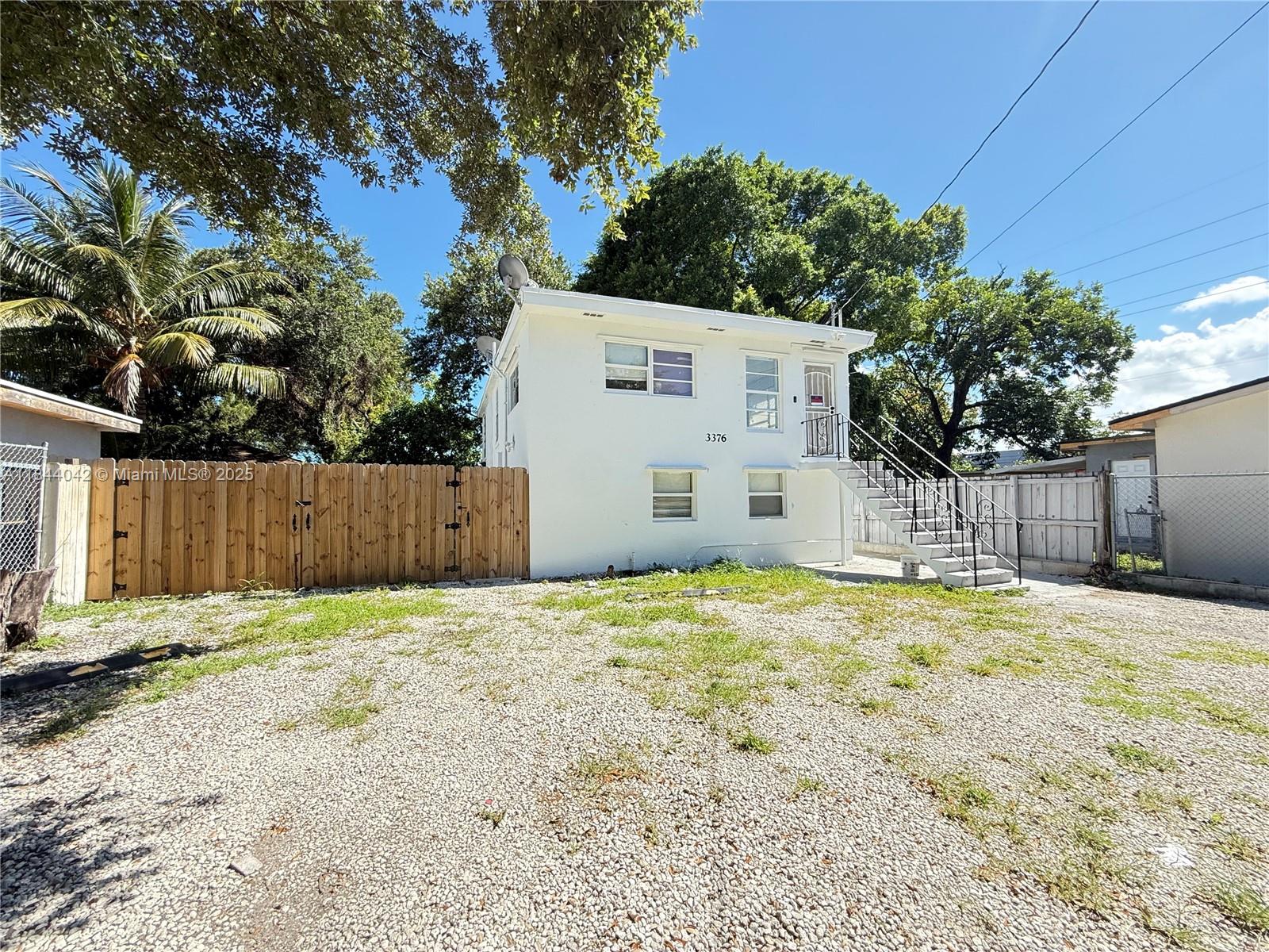 3376 Northwest 49th Street, Unit B Miami, FL 33142 - Photo 2 of 14 a backyard of house