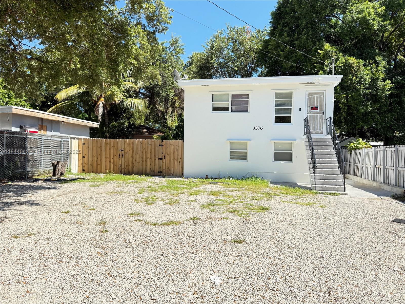 3376 Northwest 49th Street, Unit B Miami, FL 33142 - Photo 3 of 14 a backyard of a house