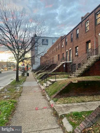 a view of swimming pool with a yard in the background