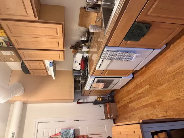 a view of wooden floor with entryway