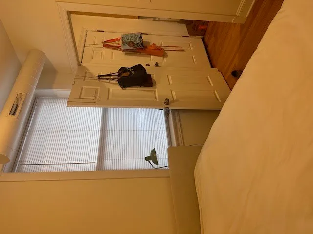 a view of a balcony with wooden floor