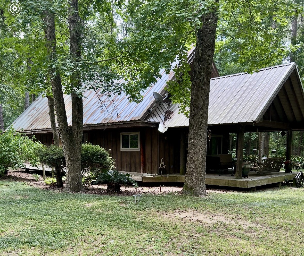 141 Walnut Loop Shepherd, TX 77371 - Photo 1 of 50 One of a kind Cusrom Cedar Cabin with 4x12 cedar beams and a metal roof.