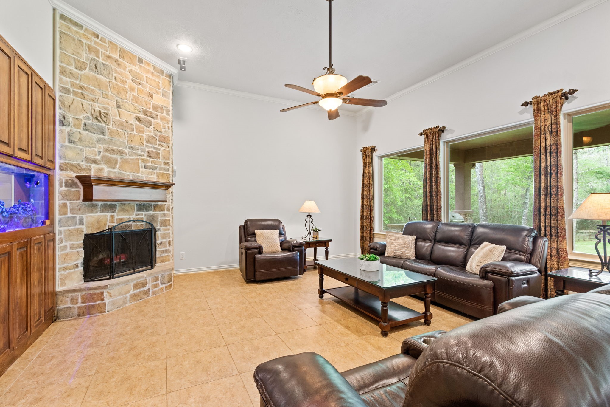 28007 Hickory Court Magnolia, TX 77355 - Photo 12 of 49 a living room with furniture ceiling fan and a fireplace