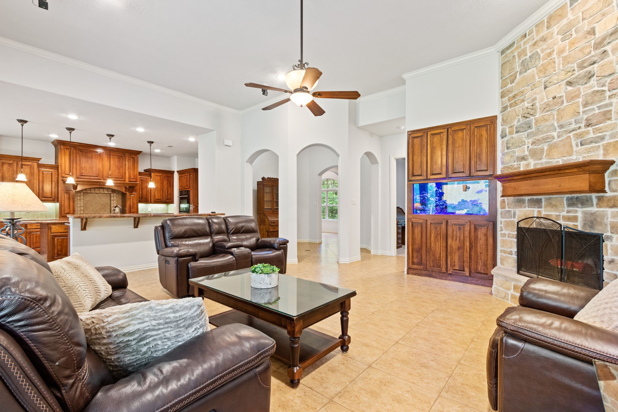 28007 Hickory Court Magnolia, TX 77355 - Photo 13 of 49 a living room with furniture a fireplace and a chandelier