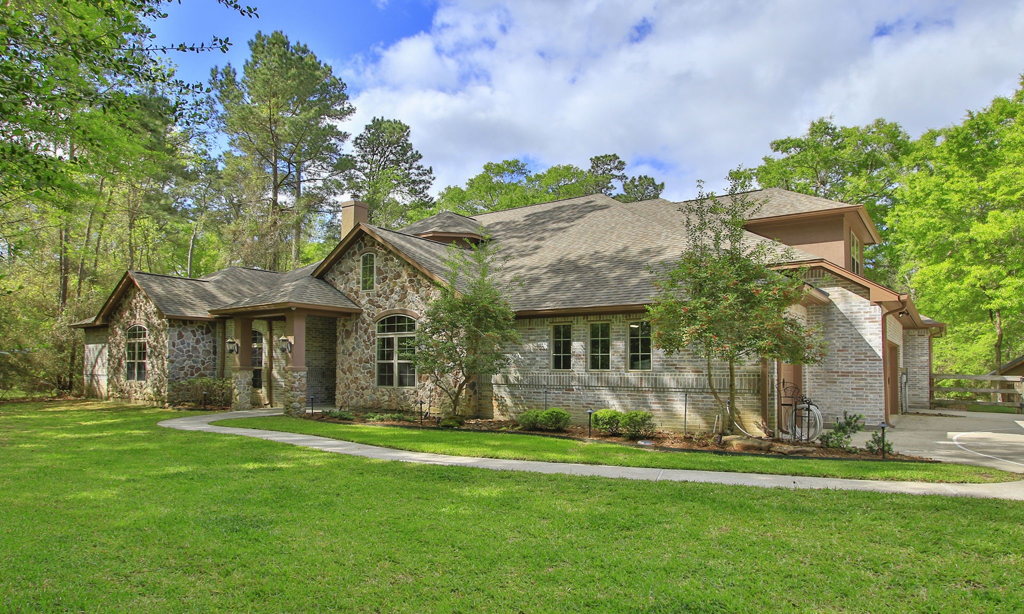 28007 Hickory Court Magnolia, TX 77355 - Photo 2 of 49 front view of a house with a yard