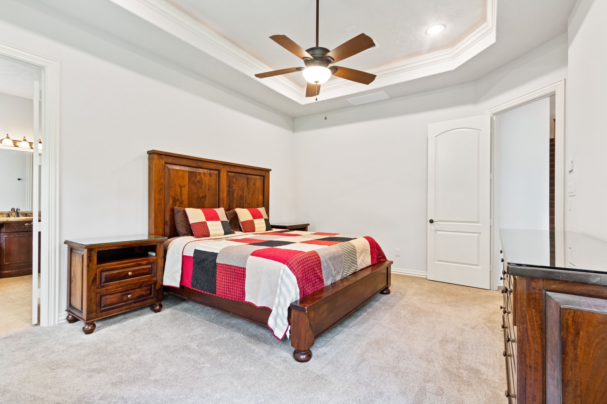 28007 Hickory Court Magnolia, TX 77355 - Photo 21 of 49 a bed room with a bed and a ceiling fan