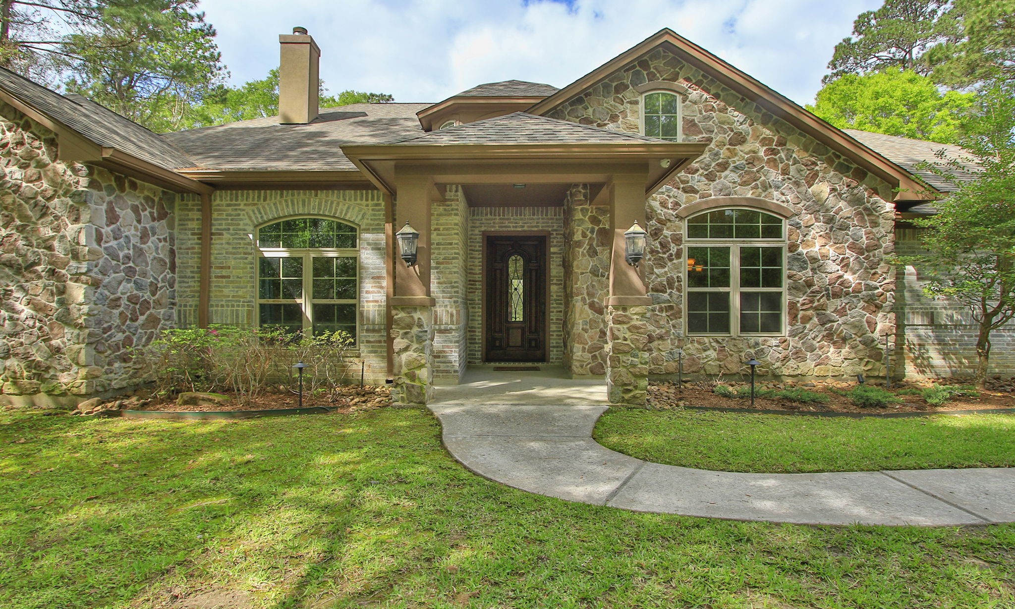 28007 Hickory Court Magnolia, TX 77355 - Photo 3 of 49 front view of a house with a yard