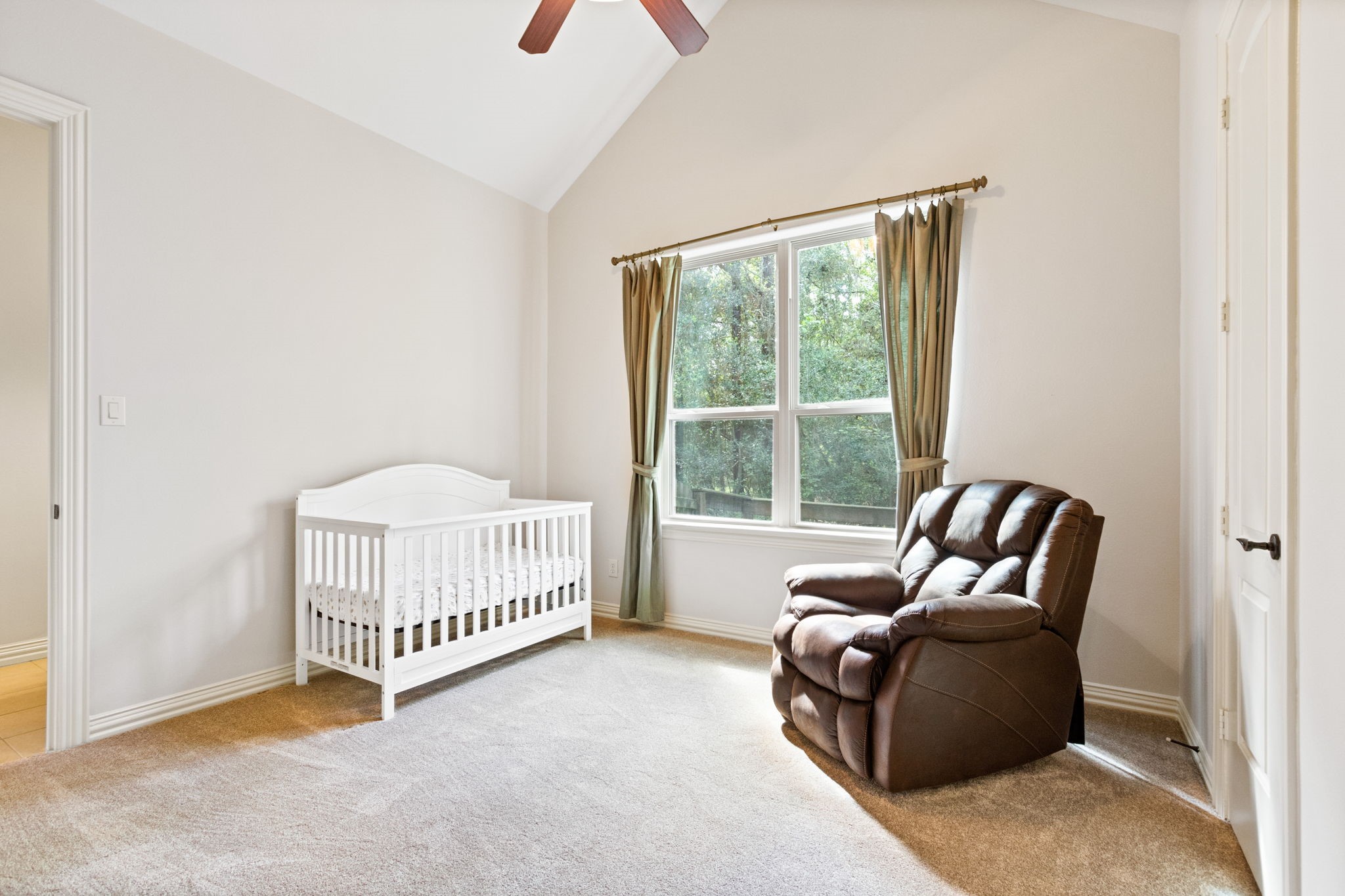 28007 Hickory Court Magnolia, TX 77355 - Photo 31 of 49 a bedroom with a couch and a window
