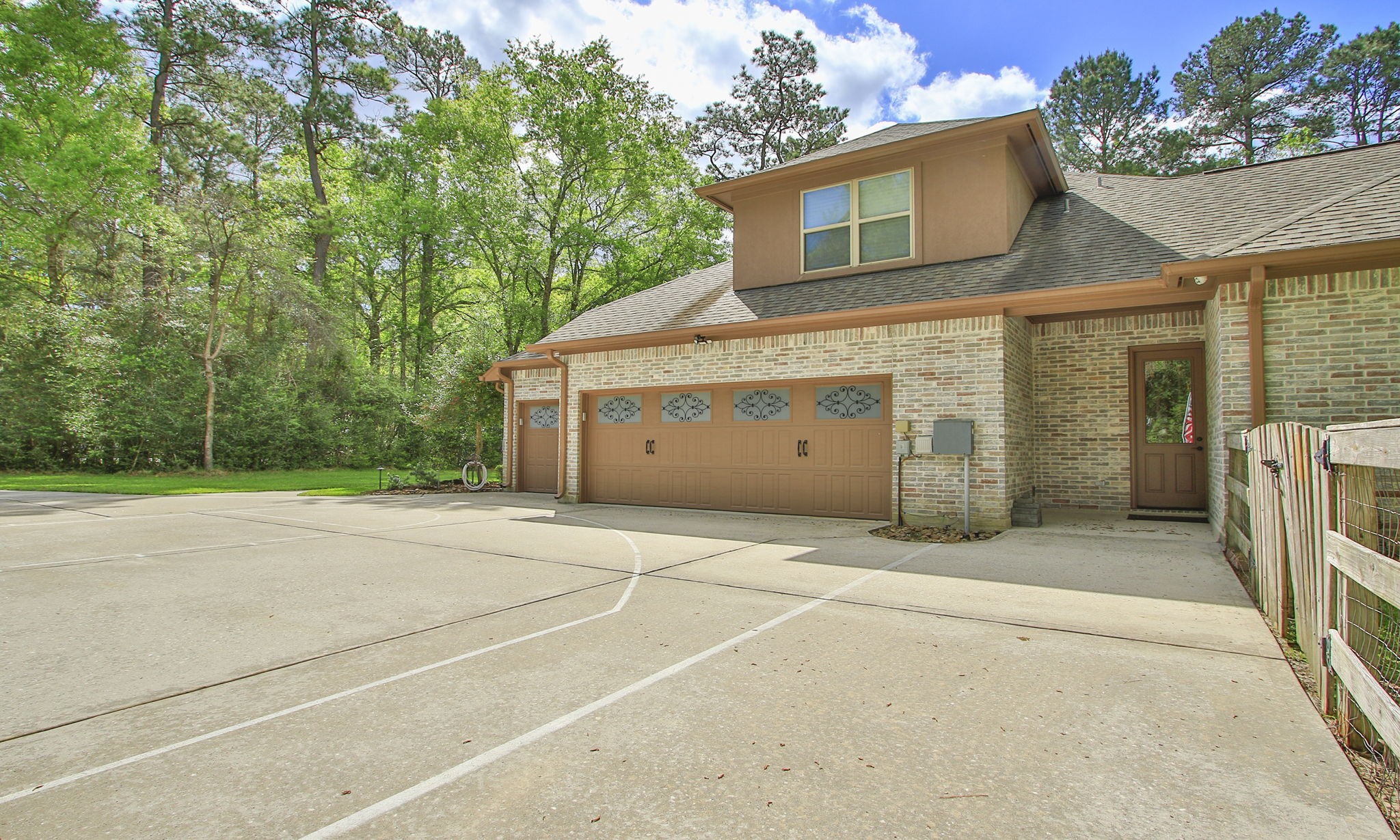 28007 Hickory Court Magnolia, TX 77355 - Photo 4 of 49 a front view of a house with a yard and garage