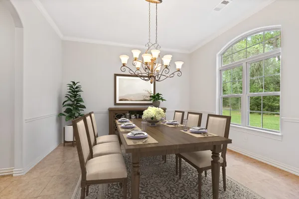 a large kitchen with stainless steel appliances kitchen island granite countertop a stove and a sink