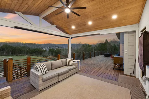a front view of a house with yard porch and furniture