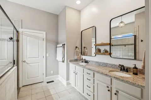 a living room with furniture and a ceiling fan