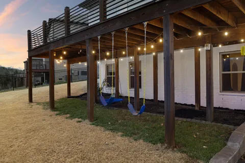 a front view of a building with potted plants