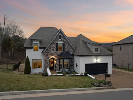 a kitchen with stainless steel appliances granite countertop a refrigerator stove and oven