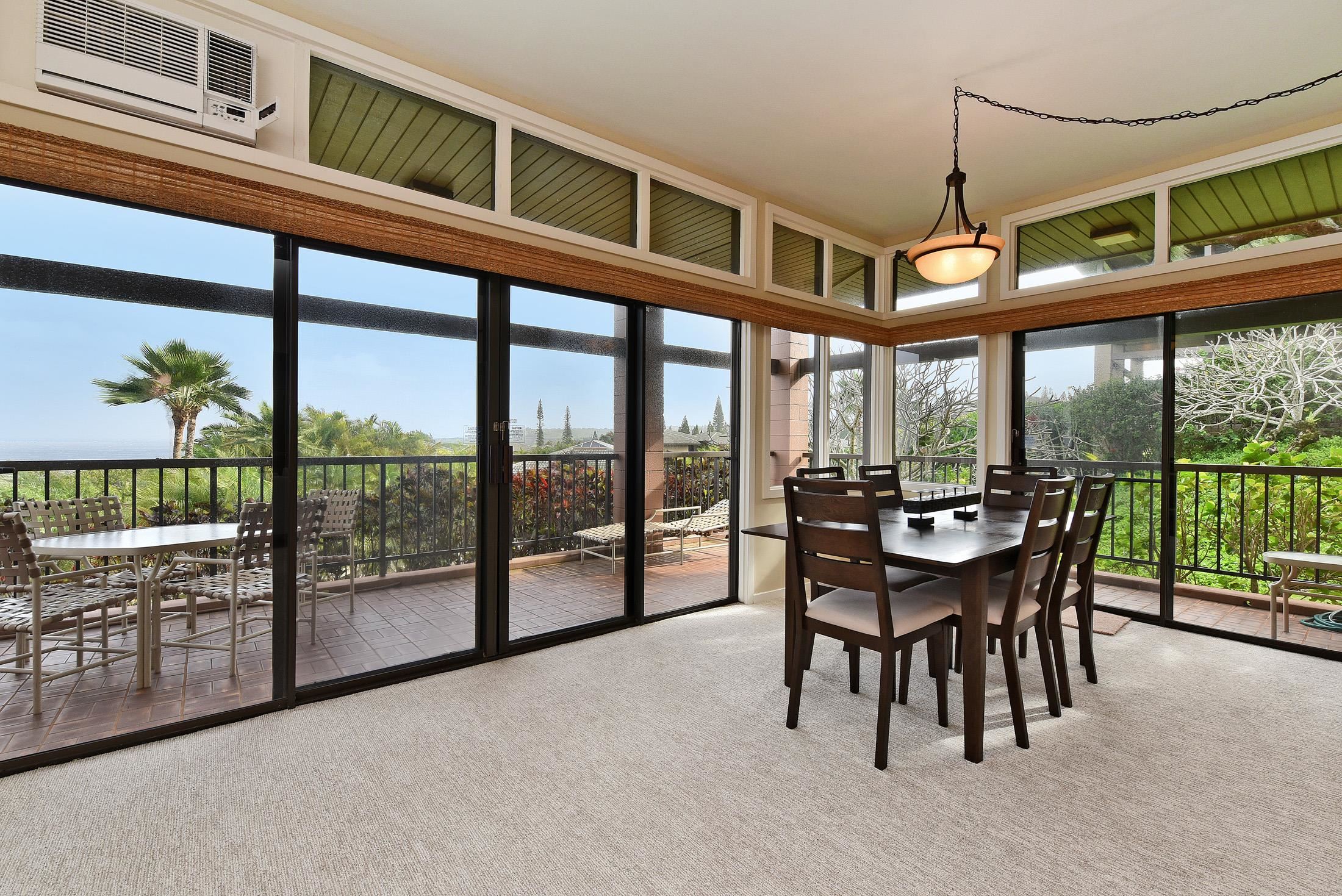100 Ridge Road, Unit 101315 Lahaina, HI 96761 - Photo 12 of 23 a dining room with furniture and floor to ceiling windows