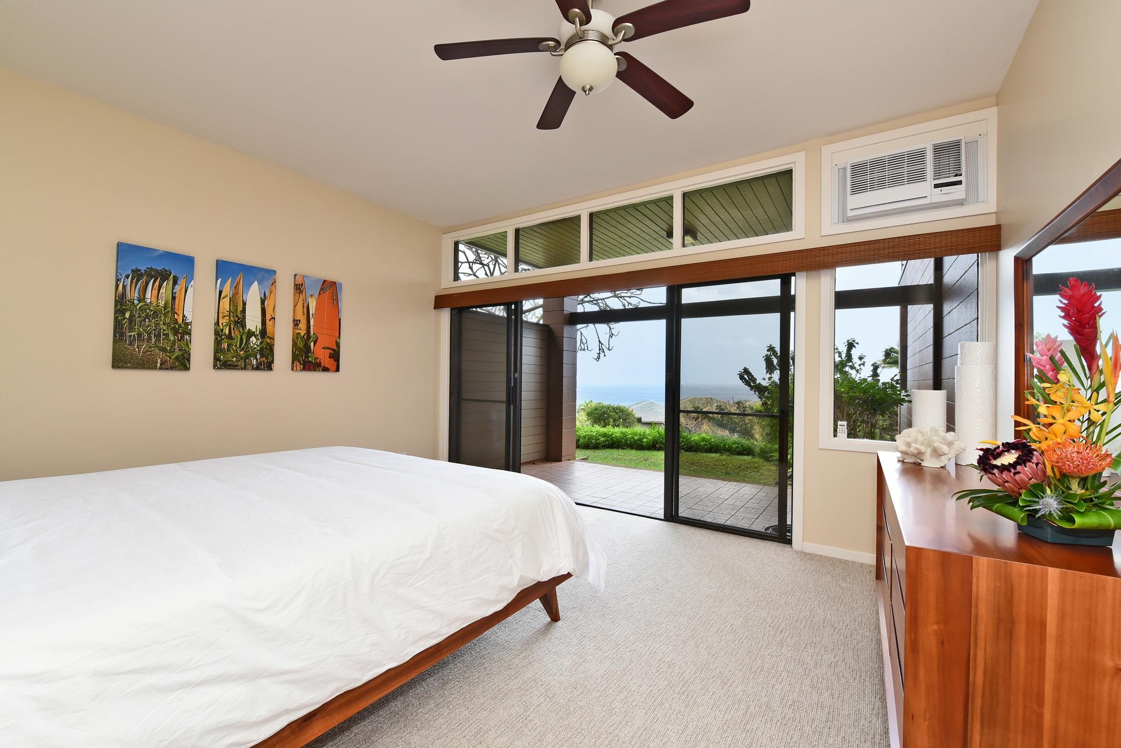 100 Ridge Road, Unit 101315 Lahaina, HI 96761 - Photo 16 of 23 a spacious bedroom with a large bed and a large window