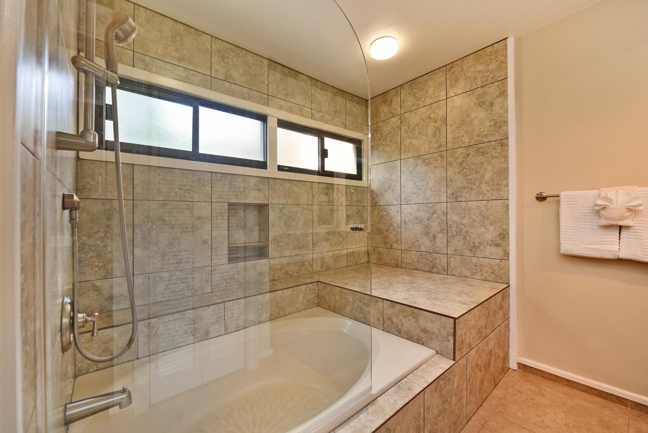 100 Ridge Road, Unit 101315 Lahaina, HI 96761 - Photo 17 of 23 a bathroom with a bathtub and shower