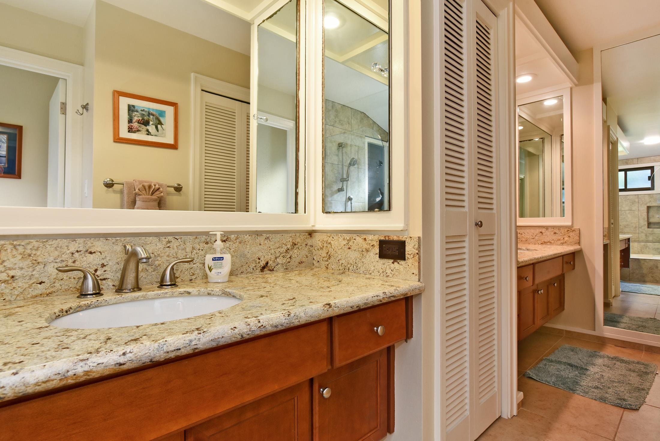 100 Ridge Road, Unit 101315 Lahaina, HI 96761 - Photo 20 of 23 a bathroom with a granite countertop sink and a mirror