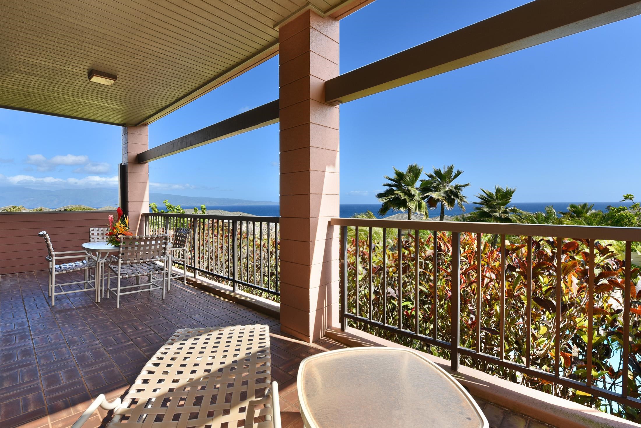 100 Ridge Road, Unit 101315 Lahaina, HI 96761 - Photo 5 of 23 a balcony with table and chairs