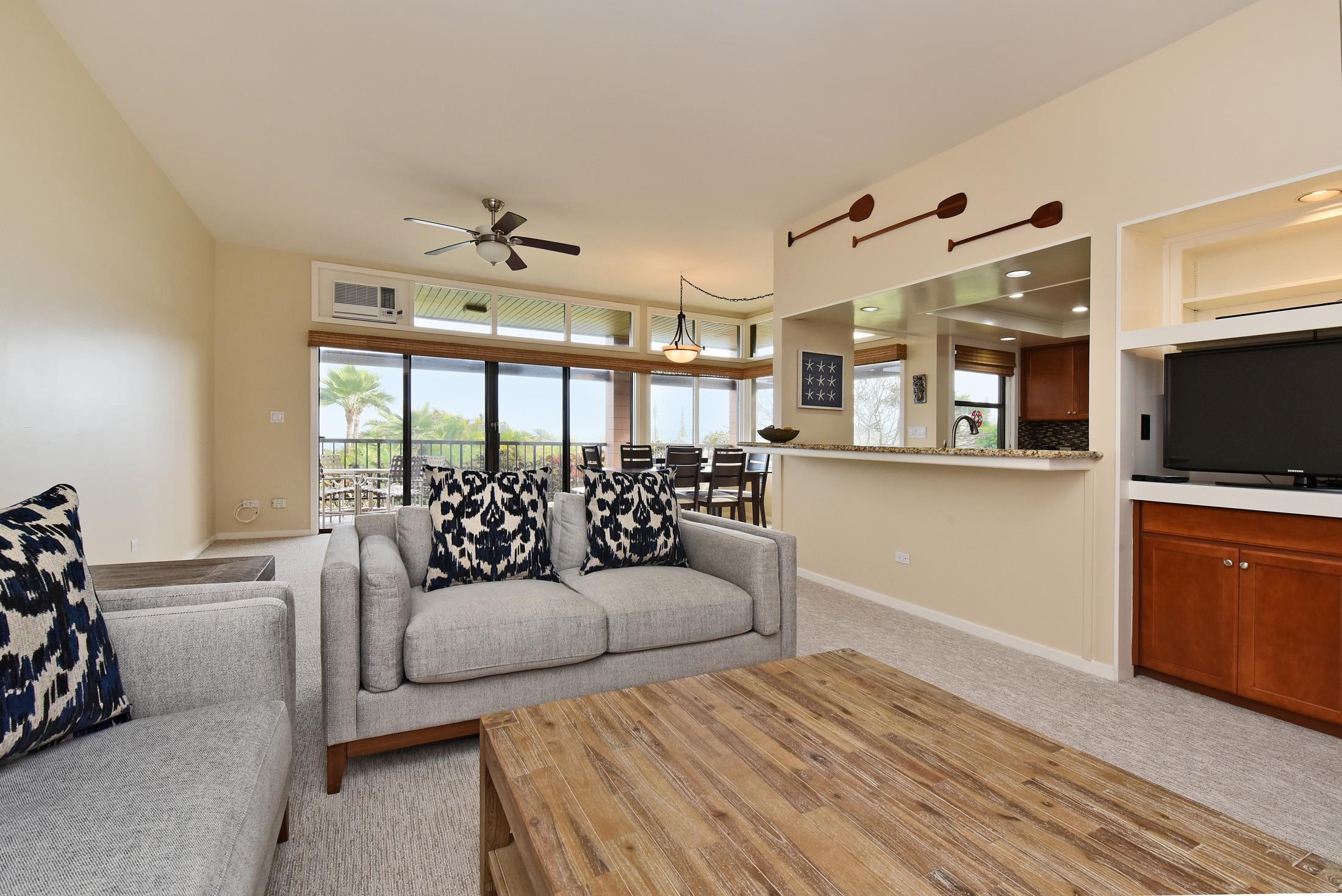 100 Ridge Road, Unit 101315 Lahaina, HI 96761 - Photo 9 of 23 a living room with furniture and a flat screen tv
