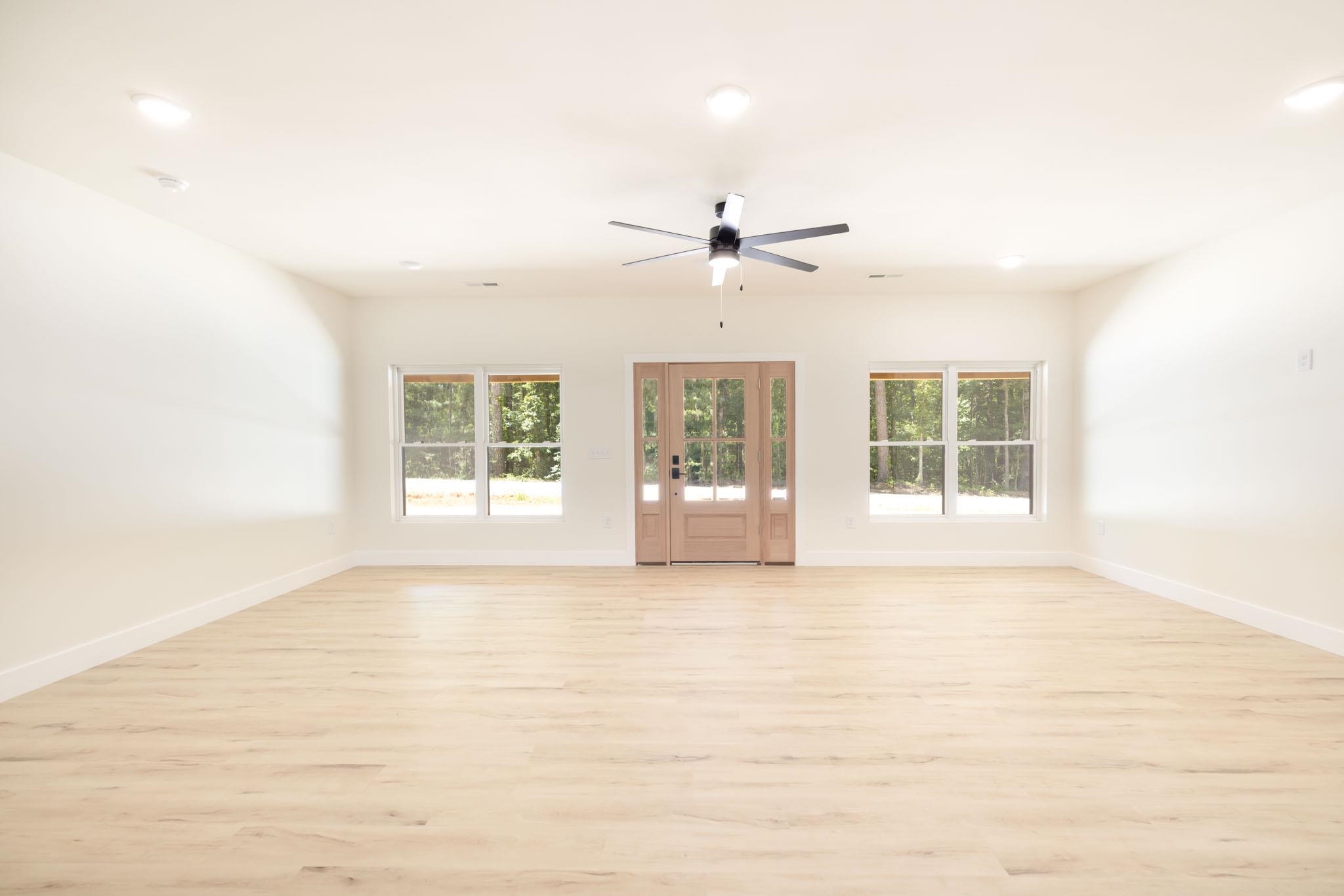 37 William Teague Lane Ramer, TN 38367 - Photo 13 of 39 Spacious room featuring light wood-finish flooring, recessed lighting, and a ceiling fan