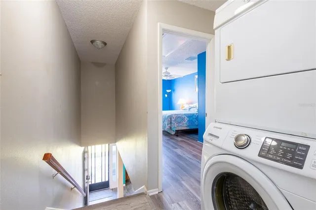 a view of a hallway with washer and dryer