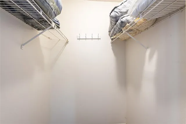 a view of a balcony with a white wall