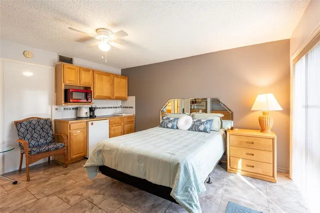 a bedroom with a bed and furniture