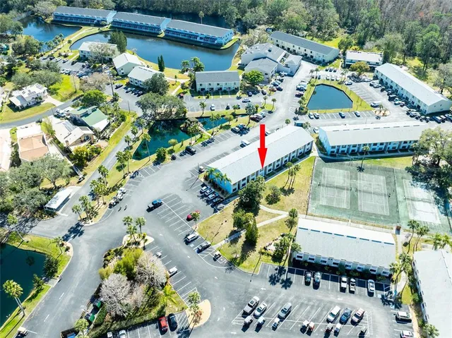an aerial view of a house with a yard and a garden