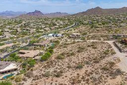 a view of a town with mountains in the background