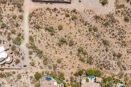 an aerial view of residential house and green space