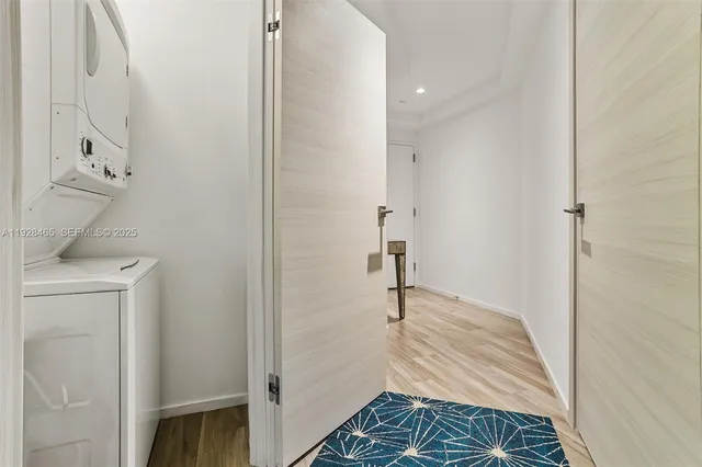 a view of balcony with floor to ceiling windows and wooden floor