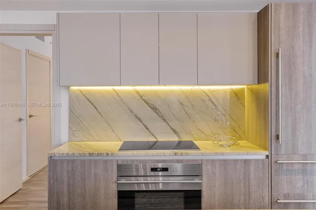 a bedroom with a bed and paintings on the wall