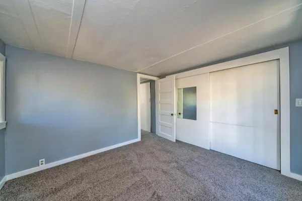 a view of an empty room with stairs
