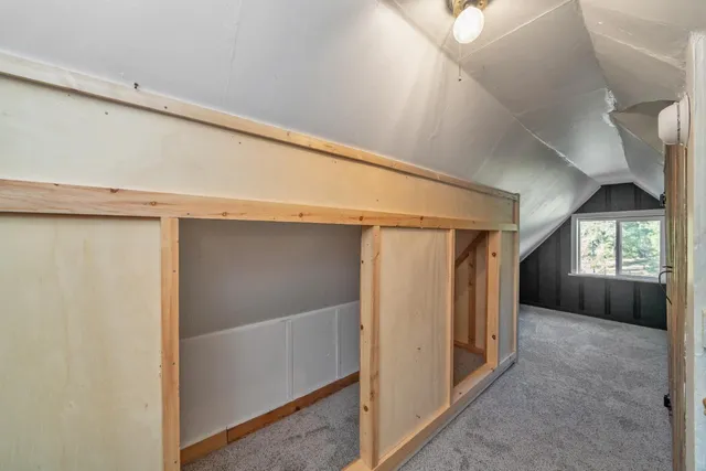 a bathroom with a sink toilet and a mirror