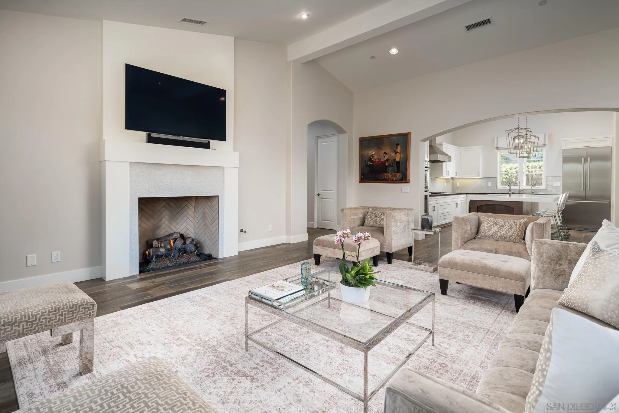 6152 Camino Selva Rancho Santa Fe, CA 92067 - Photo 12 of 37 a living room with furniture a fireplace and a flat screen tv