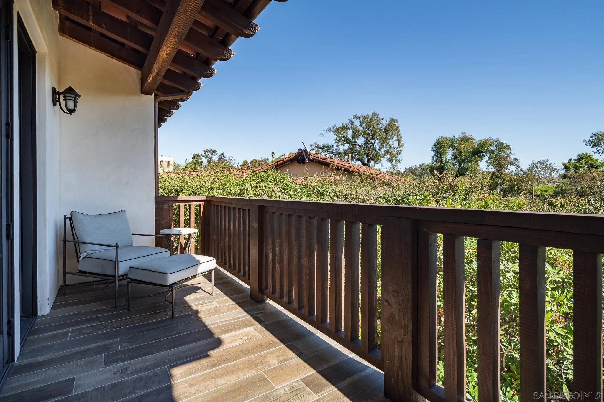 6152 Camino Selva Rancho Santa Fe, CA 92067 - Photo 15 of 37 a balcony with wooden floor table and chairs