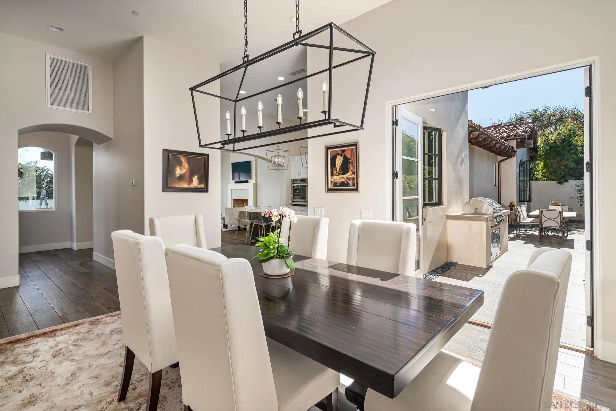 6152 Camino Selva Rancho Santa Fe, CA 92067 - Photo 17 of 37 a view of a dining room with furniture window and wooden floor