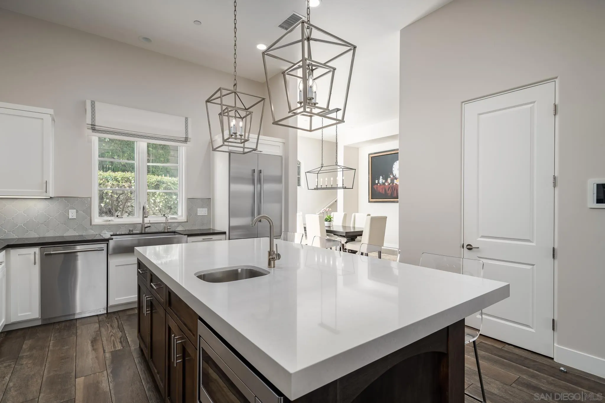 6152 Camino Selva Rancho Santa Fe, CA 92067 - Photo 19 of 37 a kitchen with center island table and chairs