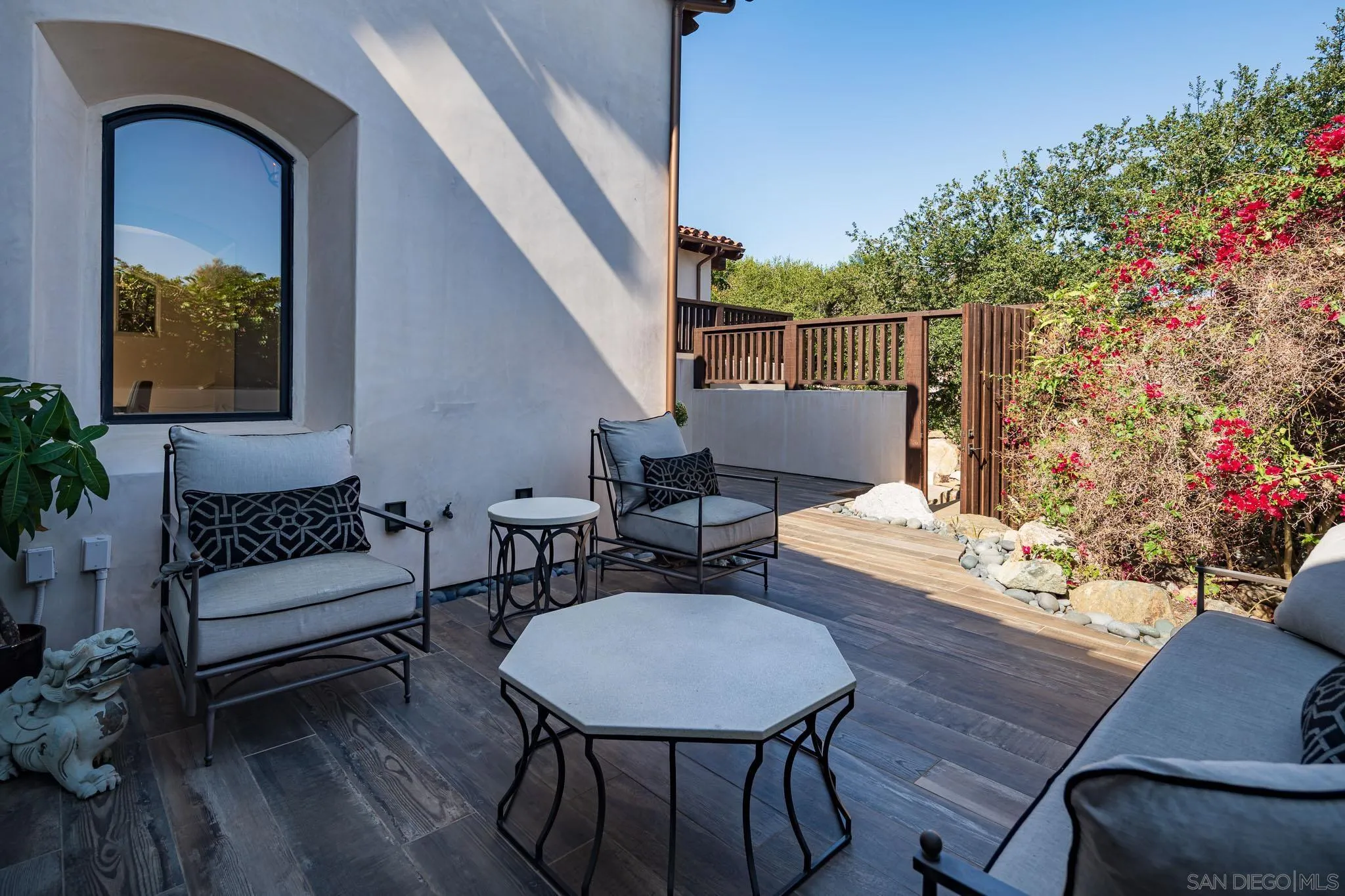 6152 Camino Selva Rancho Santa Fe, CA 92067 - Photo 7 of 37 a outdoor living space with furniture and wooden floor