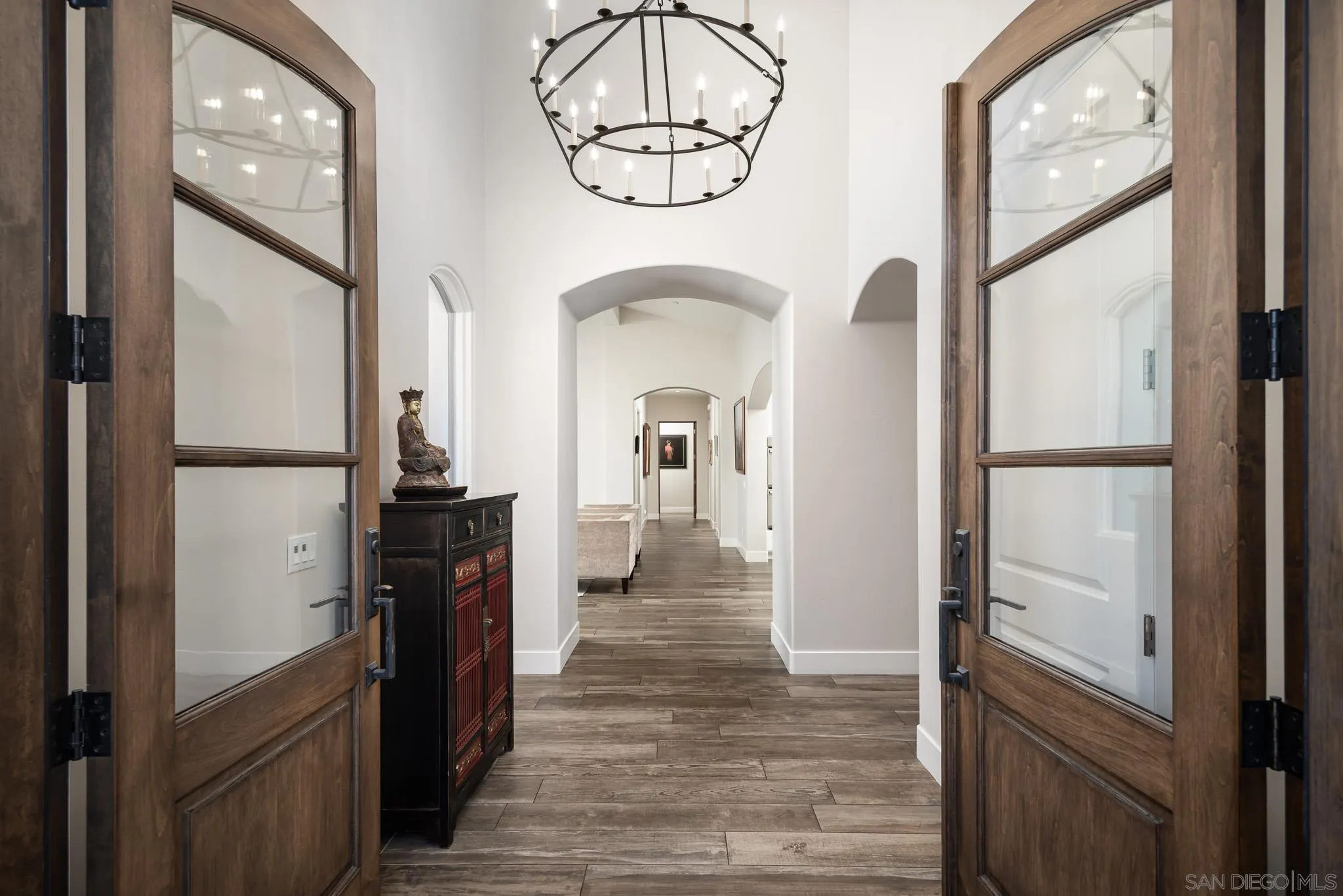 6152 Camino Selva Rancho Santa Fe, CA 92067 - Photo 9 of 37 a view of a hallway with wooden floor and staircase