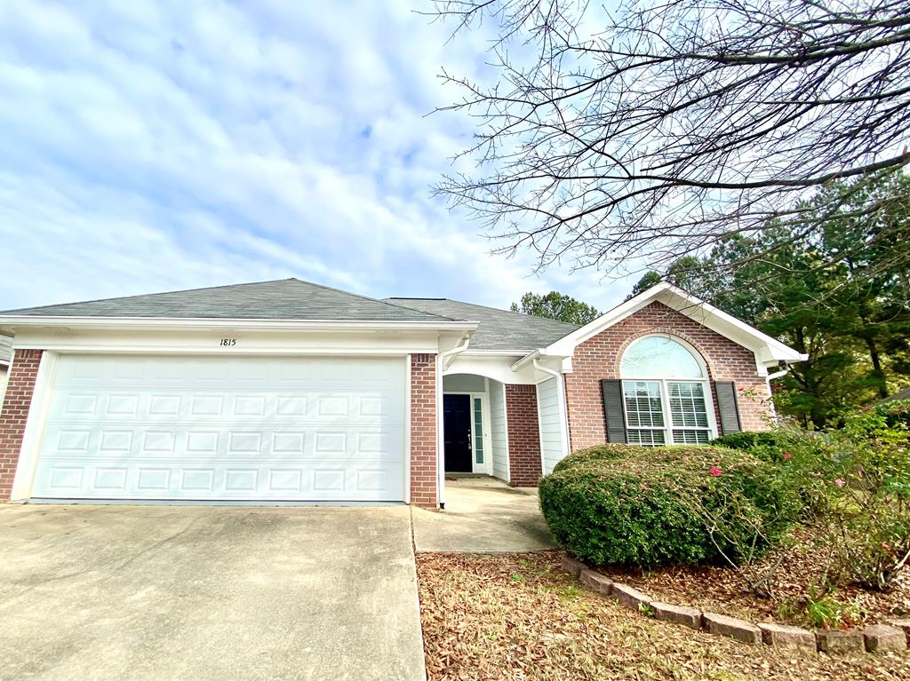 1815 Saffron Court Columbus, GA 31909 - Photo 1 of 20 a front view of a house with garden